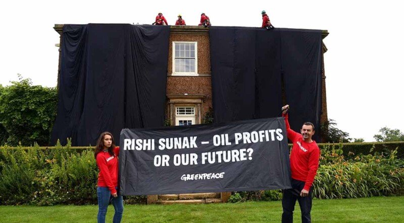 Protesters cover UK prime minister’s home in black fabric