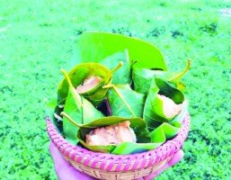 Traditional Palm pitha in jackfruit leaves