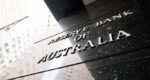 Australian central bank cuts key rate, warns of global disquiet