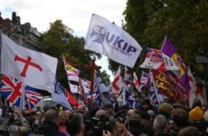 Masked Muslim protesters vow to ‘defend our community’ as UKIP march moved to central London