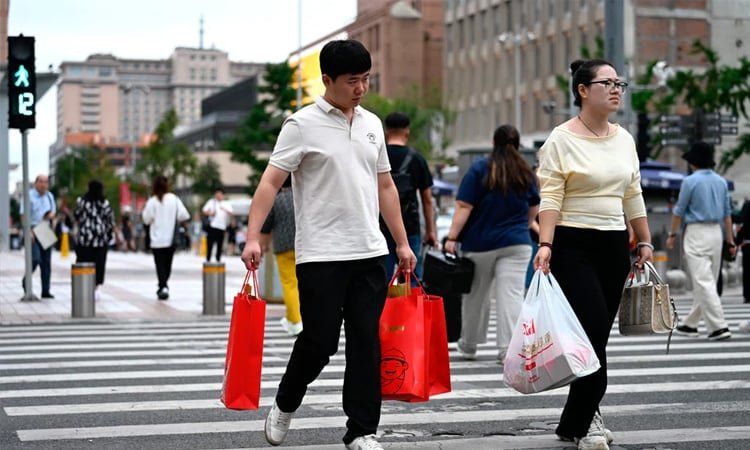 China’s retail sales and factory output weaken as consumer slump persists