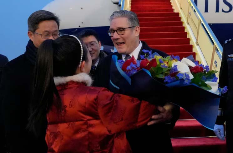 Keir Starmer handed bouquet of flowers as he arrives in China for high-profile visit
