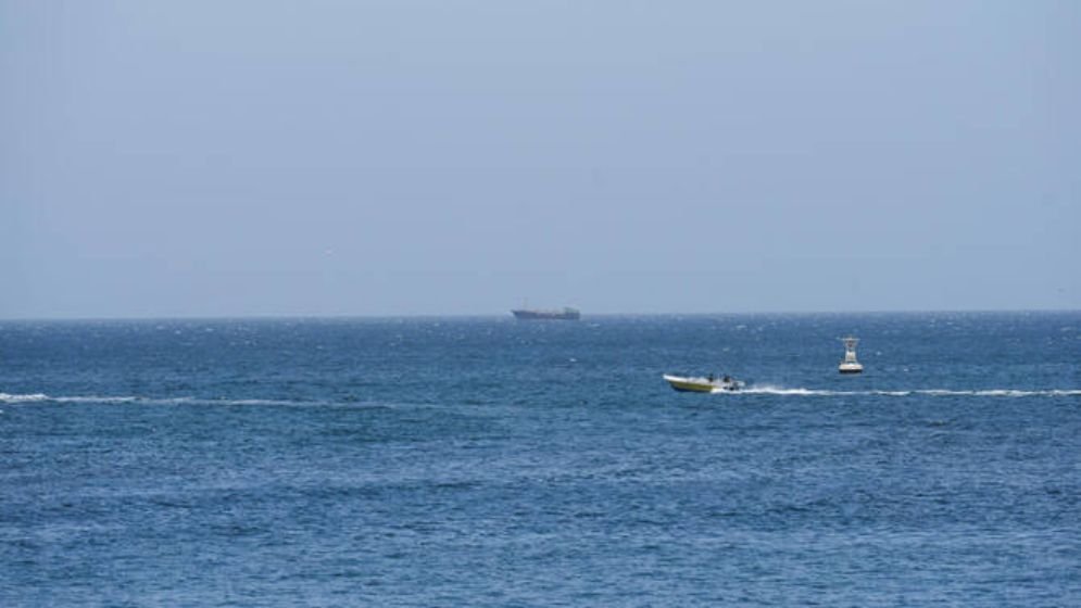 Hormuz at near standstill as Iran warns ships to keep to its waters