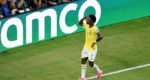 Vinicius fires Brazil into World Cup knockouts with 3-0 win over Scotland