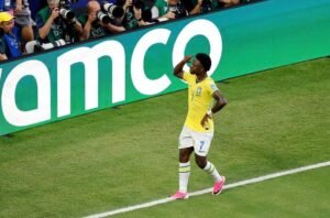 Vinicius fires Brazil into World Cup knockouts with 3-0 win over Scotland