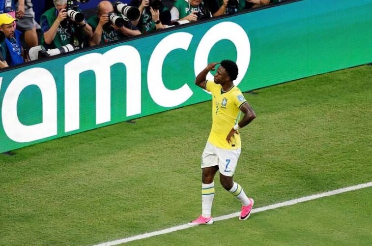 Vinicius fires Brazil into World Cup knockouts with 3-0 win over Scotland