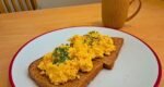 Scrambled eggs will be tastier if you swap milk and butter for a much better ingredient